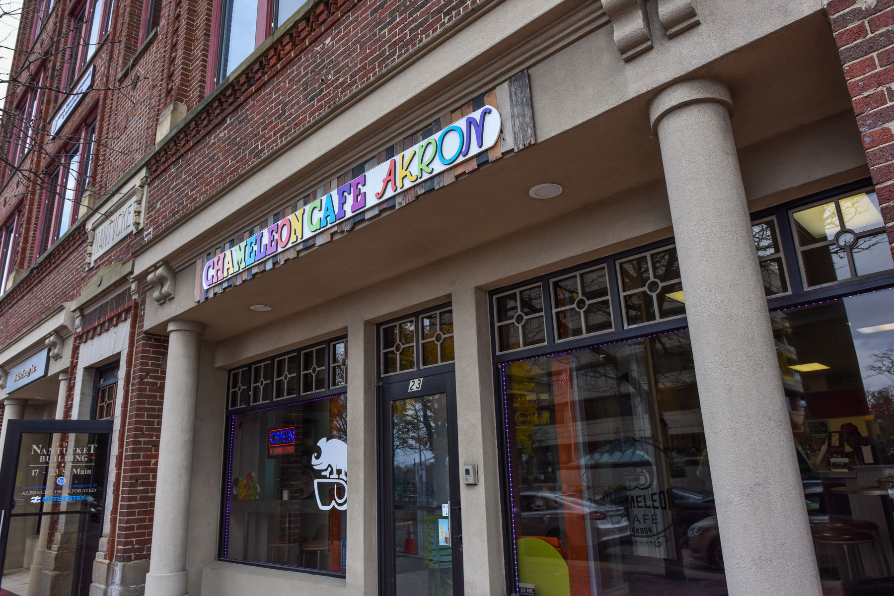 An image of a bright blue shelf with various nick-nacks inside Chameleon Cafe in downtown Akron.
